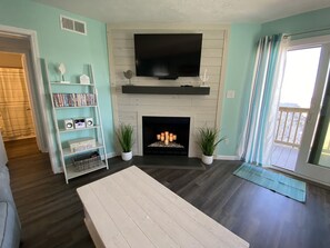 Flat Screen TV and Candle Lit Fireplace