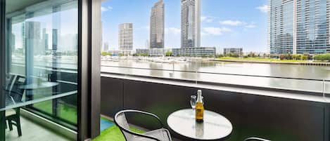 Enjoy a wine while you relax on the balcony. There is a endless stream of activity happening on the Yarra River.