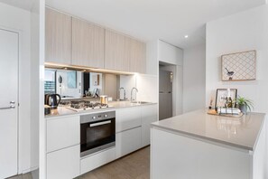 Everything you need to cook meals. Microwave, dishwasher and bins are all discretely hidden behind cupboard doors.Complimentary Wine and snacks.