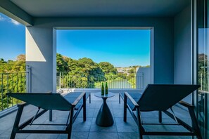 Enjoy the view of tall trees and Hija river from balcony / The view of the tall trees and the Hija River from the balcony is spectacular!