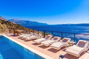 Pool. Sun deck area with 10 sun deck chairs offering absolute privacy