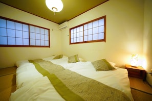 The second bedroom is a Japanese-style room with 3 futons.
