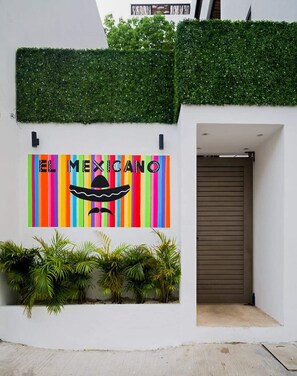 Stylish apartment with vibrant flag wall in Playa del Carmen