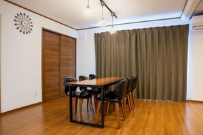 Stylish dining table and fashionable hanging lighting.