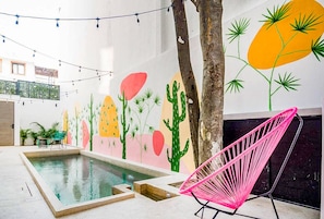 Charming hammock next to a pool, available in our Playa del Carmen accommodation
