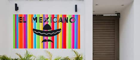 Spacious apartment for rent in Playa del Carmen with a flag-themed wall