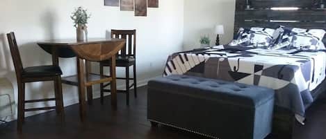 Queen Bed and High top table with 2 Stool Chairs