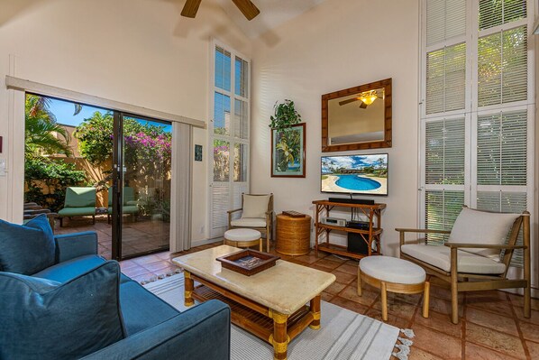 Comfortable living room has access to the private lanai. 