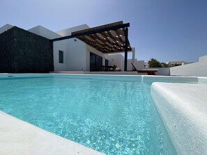 Private swimming pool heated by heat pump