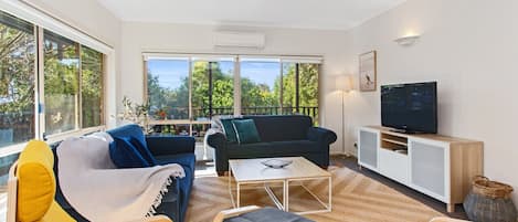 Bright and colourful downstairs living area with split system heating and cooling