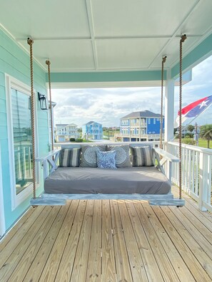 Custom swing bed on private master bedroom balcony. 