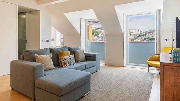 A comfy living room with a beautiful view over the beautiful city of Lisbon  #airbnb #airbnblisbon #portugal #pt #lisbon