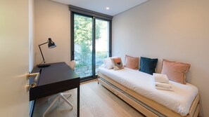 A modern and cozy single bedroom with a large source of natural light #airbnbporto #portugal #porto #modern #cozy