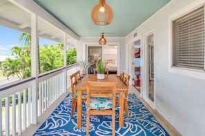 Front lanai dining table with sunset views