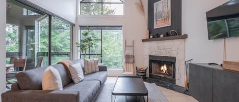 Beautifully renovated townhome living area. Complete with wood burning fireplace and smart TV.
