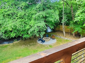 [Backyard] View from the upper deck overlooking the firepit and Hemptown Creek.