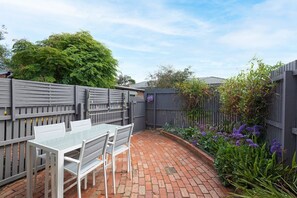 Secure fenced court yard perfect for kids and pets! 