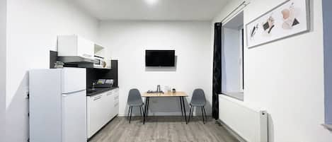 In the dining area you can watch TV and have a meal. 