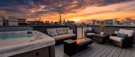 Private rooftop deck with incredible views of downtown. Complete with HOT TUB, outdoor BBQ, fire pit, and lounge area.