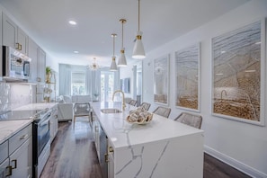 Full kitchen with bar seating for 4