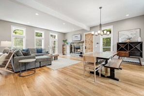 Living Area w/ Modern Decor, Wood Fireplace & Open Floorplan