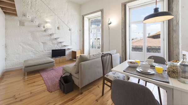 Stylish open living area with a connection to the balcony #stylish #porto #airbnbporto #portugal