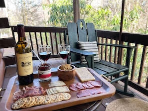 Relax on the screened-in porch and enjoy the surrounding greenery.