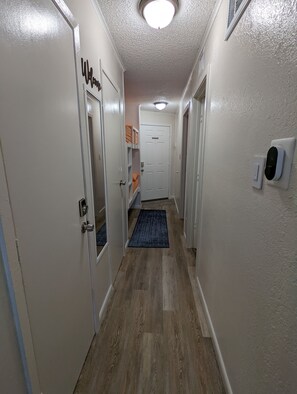 Hallway entrance, bunk beds to the left.