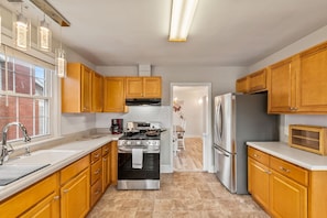 Fully stocked kitchen with brand new stove and fridge!