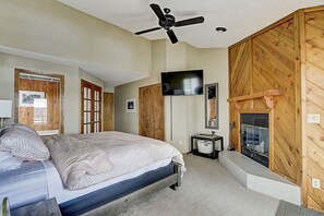 Master bedroom (King, plus twin in closet) with walkout door to patio. (Due to code, fireplace is not available for guest use.)