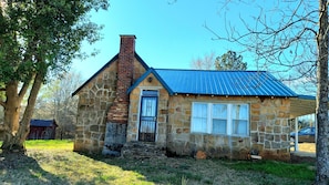 Front of home.  Cottage is made of Tishomingo Stone that was quarried locally.