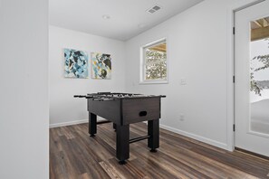 Foosball table in basement for family fun