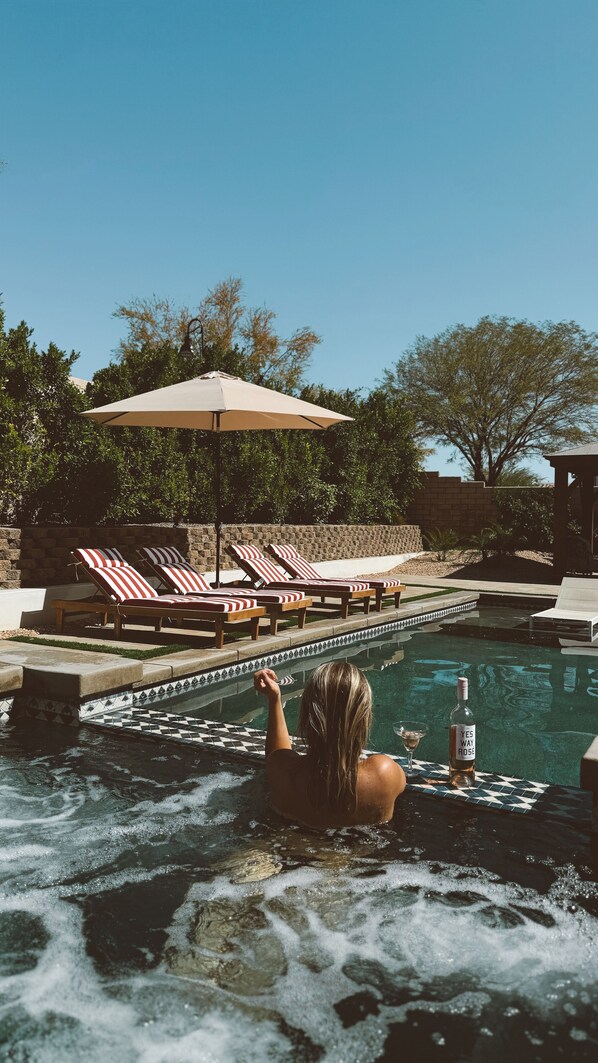 Relax and have your favorite beverage in the oversized hot tub