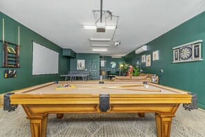 Gameroom filled with fun! Beach pool table, darts, ping pong, games and more!