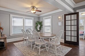 Large dining table with additional leaf that can seat up to 10 people comfortably.