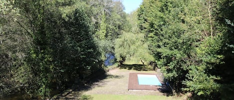 River, garden and pool.