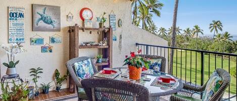 Lanai with table for seating and golf course views