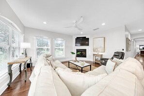 Stunning modern coastal design, natural light and pottery barn sectional.