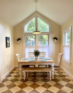 Bright breakfast nook in the kitchen with access to the back deck and yard.