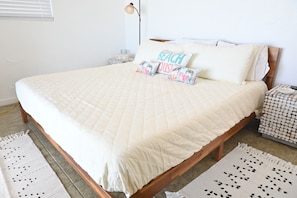King bed with premium bedding with direct sea view