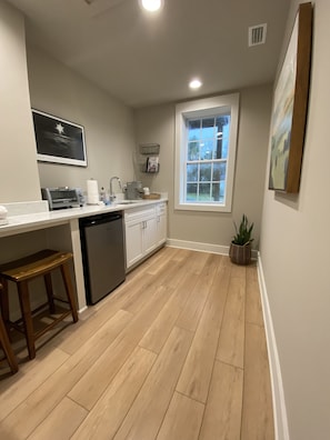 Kitchenette includes Keurig coffee maker, mini fridge, and other essentials.