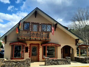 Front view of Chalet Munich above retail store