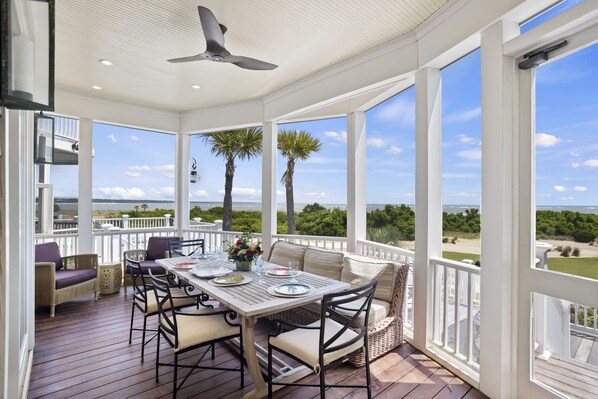 Enjoy the Incredible Ocean Views while eating appetizers on the screened porch.