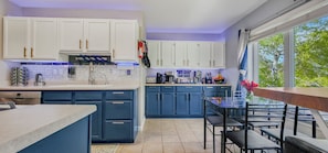 Coffee bar with 5 brew options & high-end appliances in stylish kitchen view