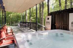 Soak your worries away in our hot tub. Watch the sun set behind the trees from the covered deck.