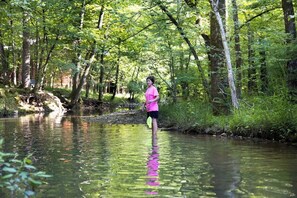 With over 210 feet of creek frontage, kids can play in the water or watch for fish.