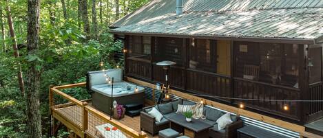 Relax under the trees on the large outdoor deck