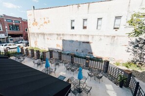 Your balcony's French doors open up to a lovely courtyard.