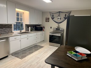 Kitchen with new appliances and double door refrigerator for plenty of room.