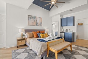 Master Bedroom suite with a bench at then of the bed. 